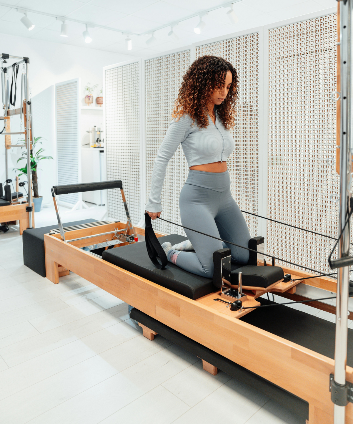 Pilates reformers with tower for full-body home and studio training