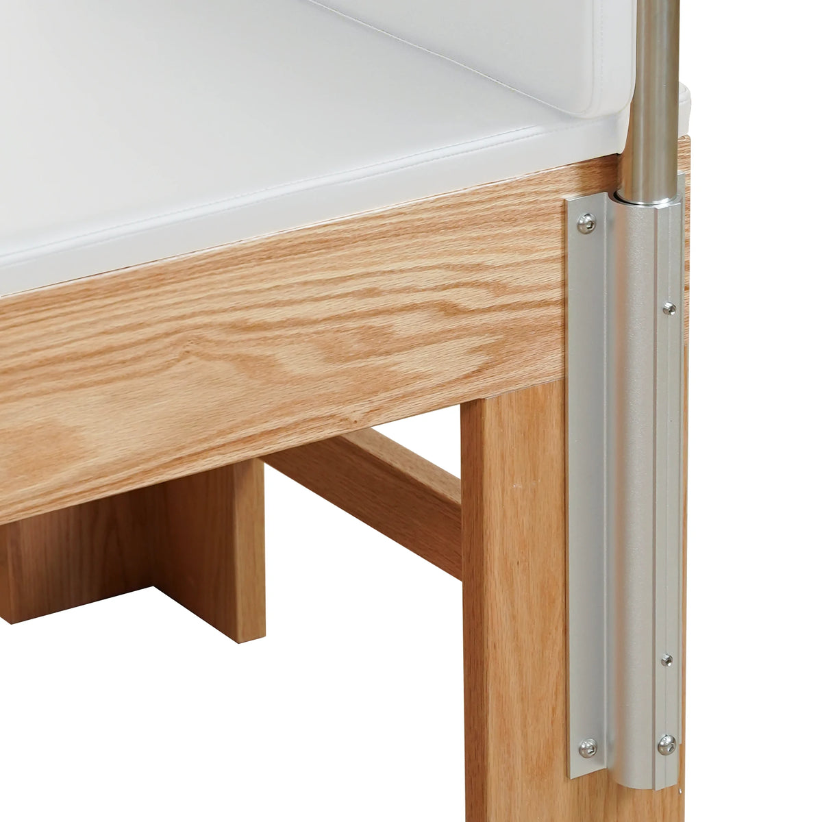 Upholstered bed and frame detail on a Gymfrog Pilates Cadillac