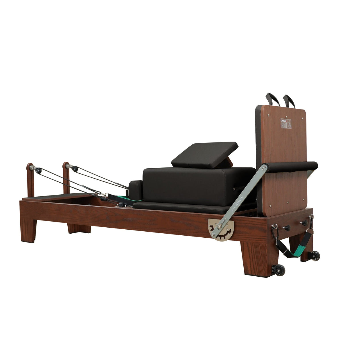 Gymfrog Pilates reformer with black upholstery, three-quarter view from the footbar end
