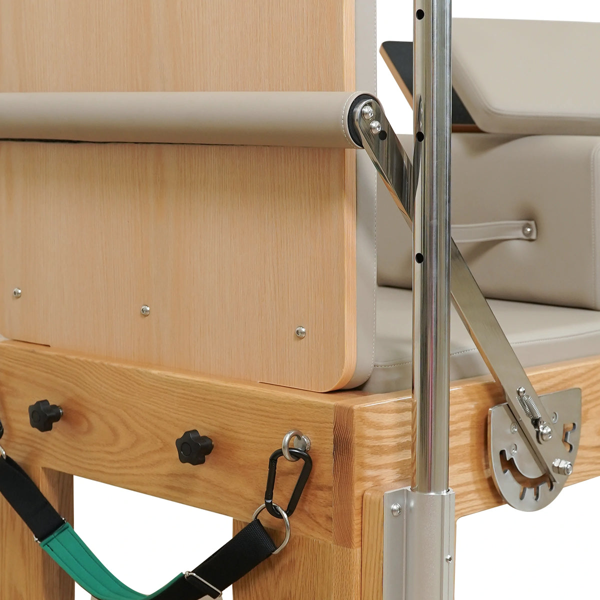End panel, footbar adjustment bracket and attached strap on a Gymfrog Cadillac Reformer Combo