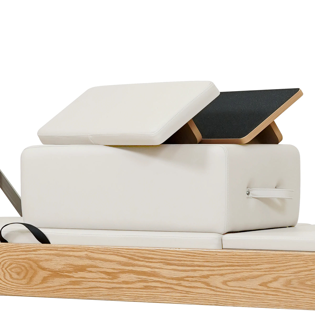 Stacked upholstered box and loose padded panels in beige on a Gymfrog Cadillac Reformer Combo