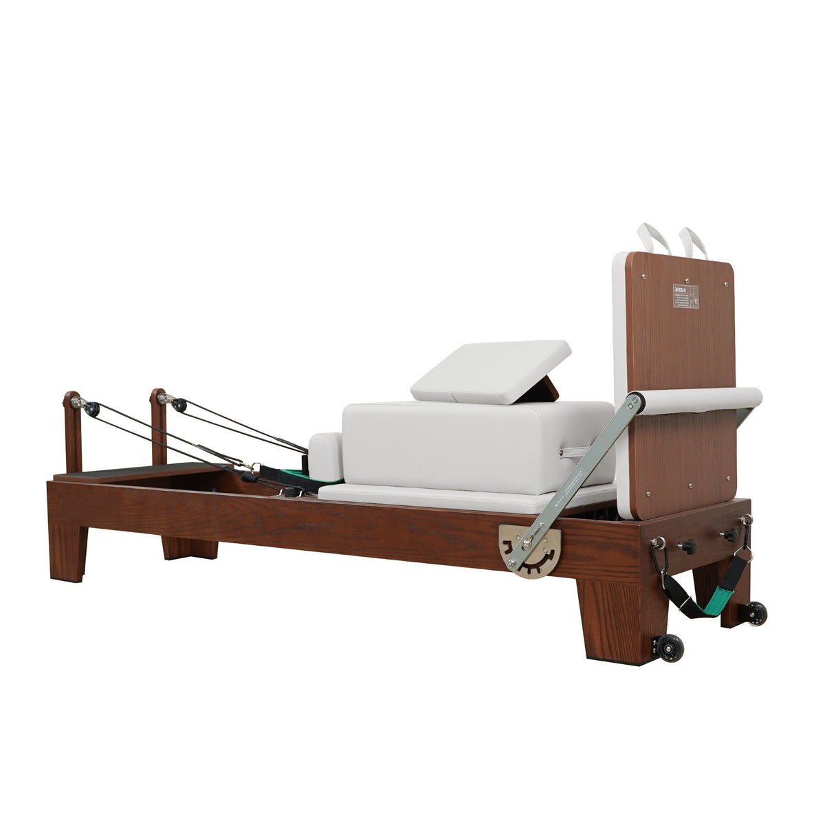 Gymfrog Pilates reformer with beige upholstery, three-quarter view from the footbar end