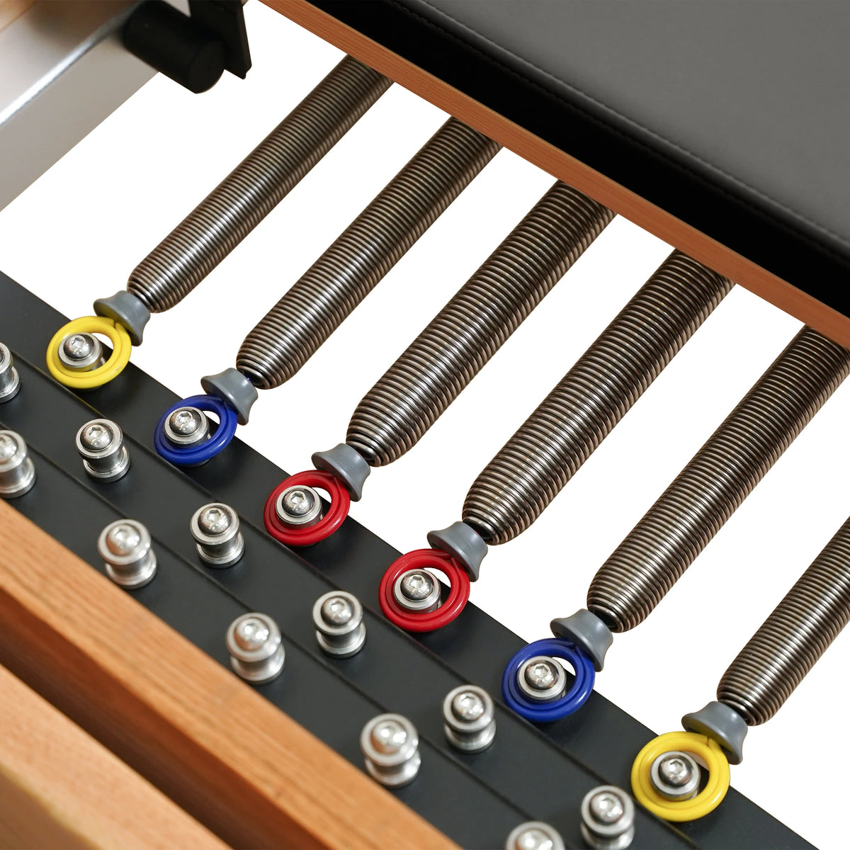 Color-coded Reformer springs and attachment points on a Gymfrog Cadillac Reformer Combo