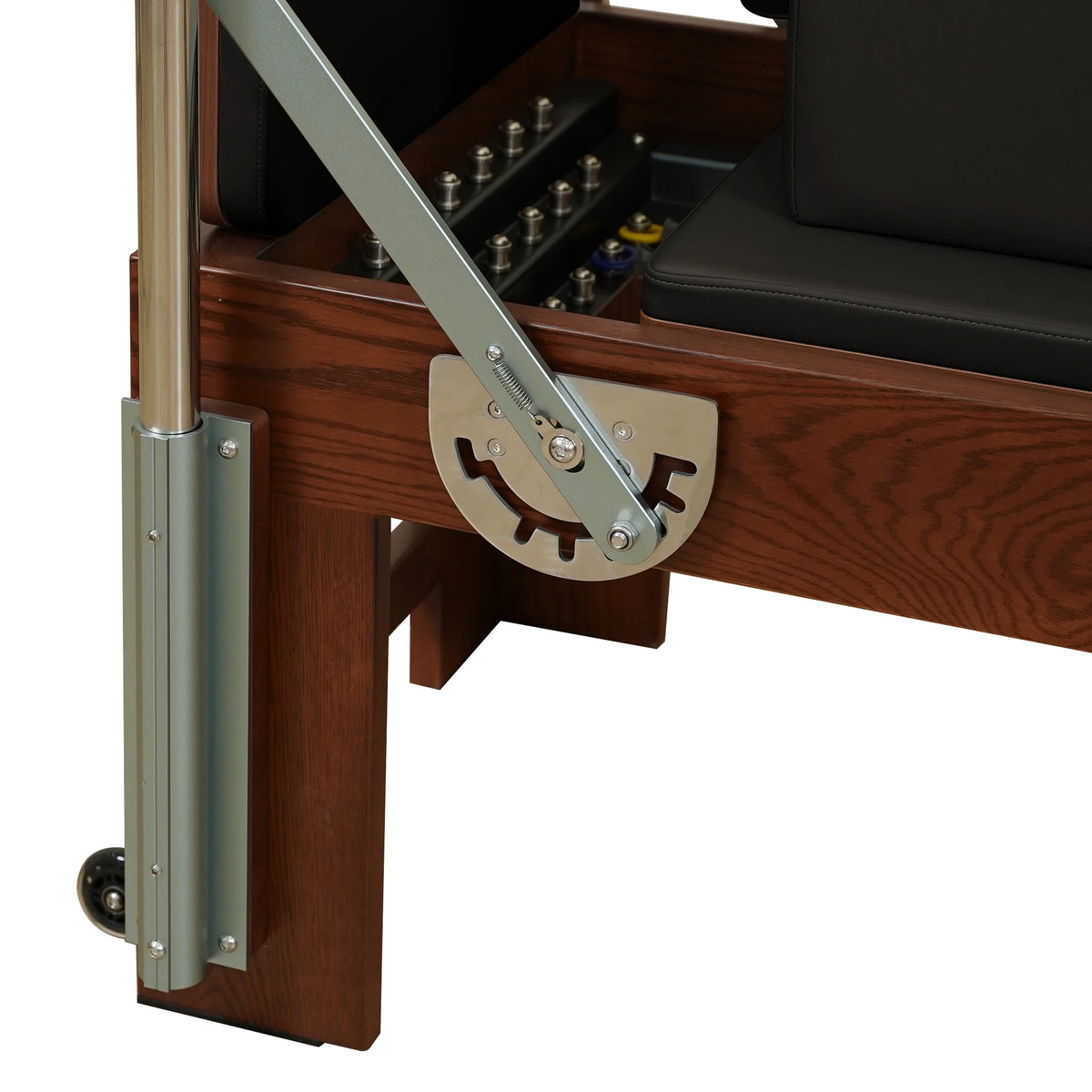 Footbar adjustment bracket beside the carriage on a Gymfrog Cadillac Reformer Combo
