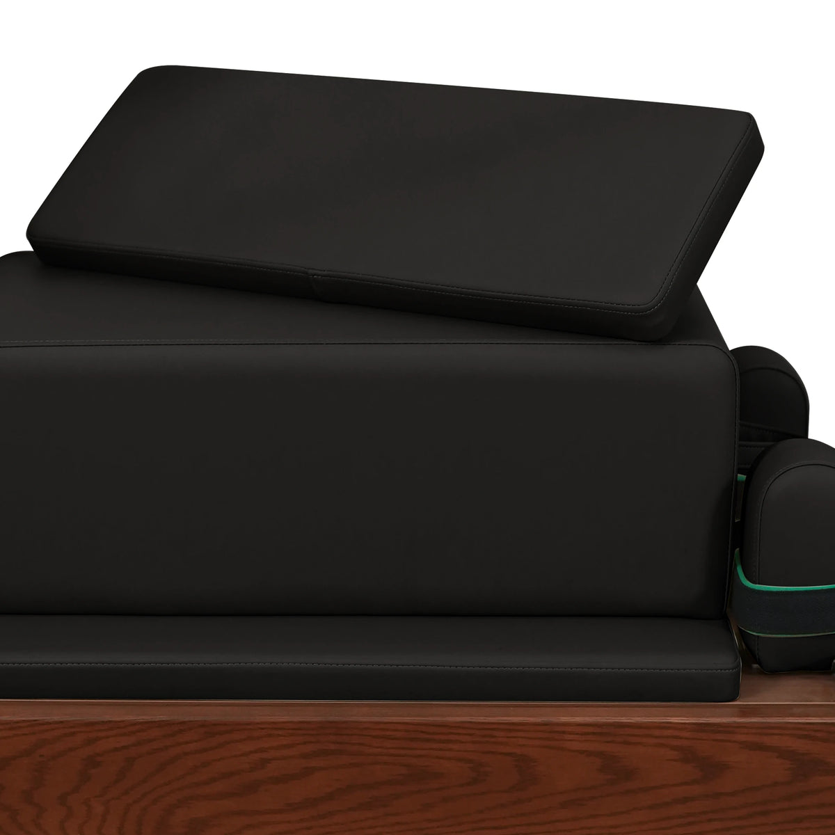 Stacked upholstered box and padded panels in black on a Gymfrog Cadillac Reformer Combo